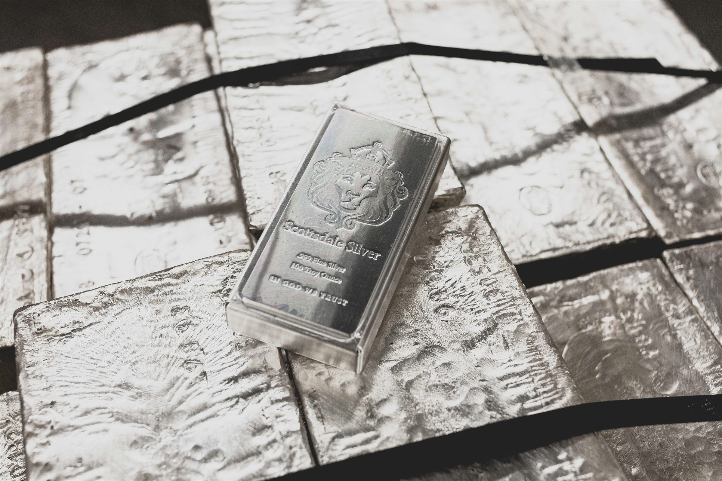 Silver bars cast in dramatic light.