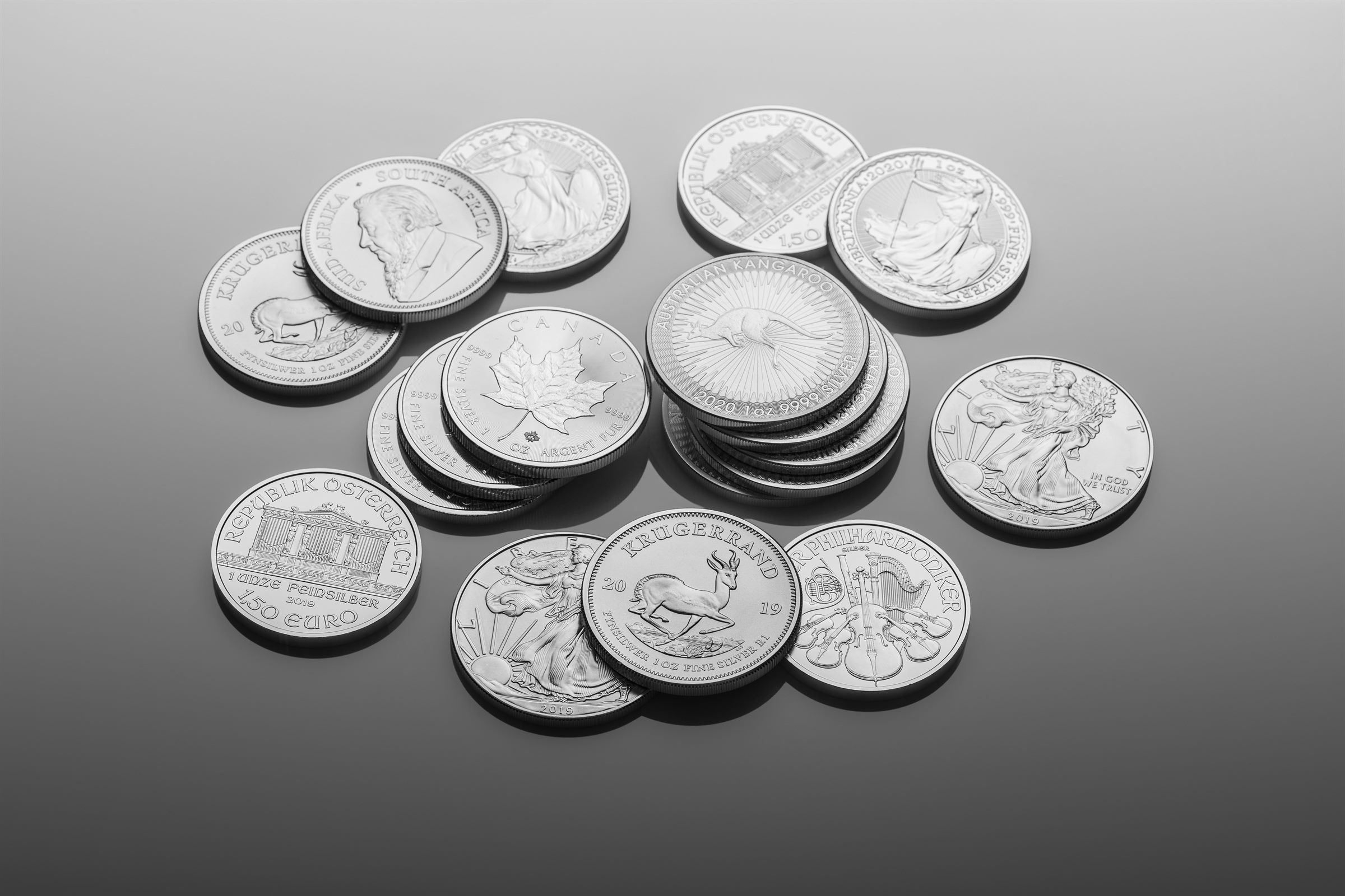 Assortment of one-ounce silver bullion coins.